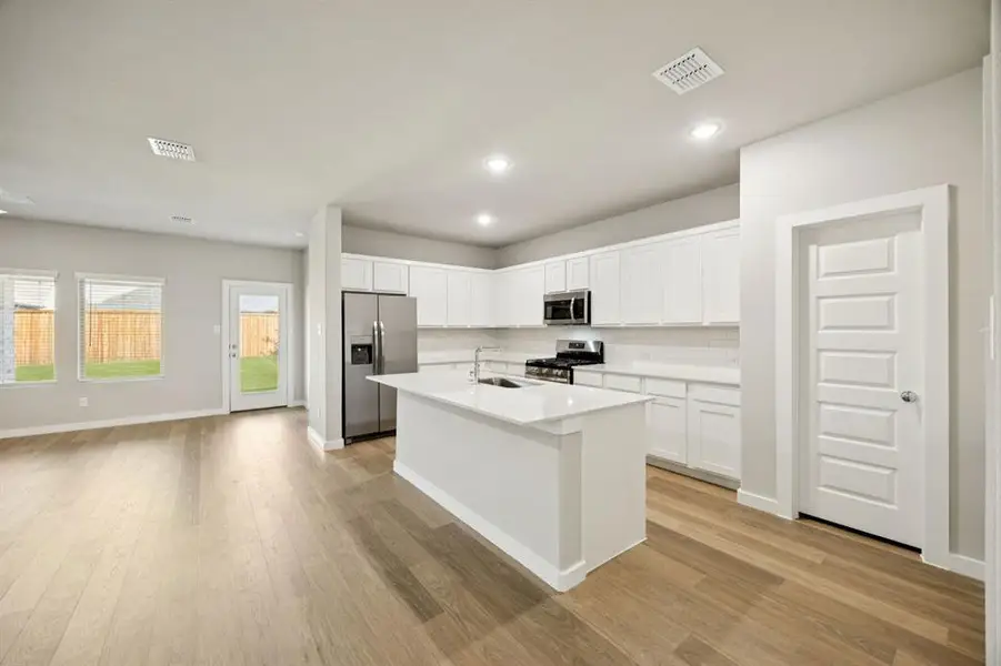 Kitchen in the Oscar home plan by Trophy Signature Homes – REPRESENTATIVE PHOTO