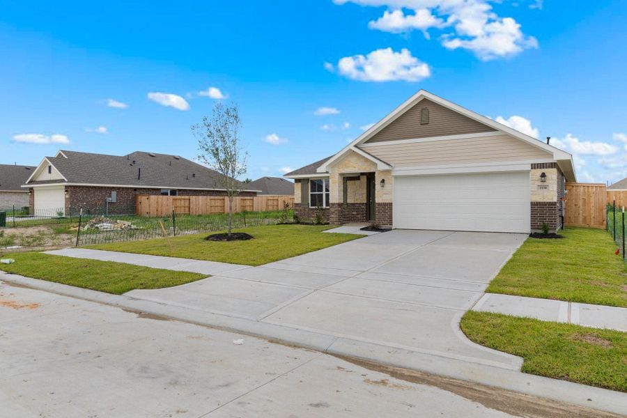 Front exterior of a new home in River Ranch Trails, Dayton, TX, highlighting curb appeal (Image 2). Front exterior of a new home in River Ranch Trails, Dayton, TX, highlighting curb appeal (Image 2).