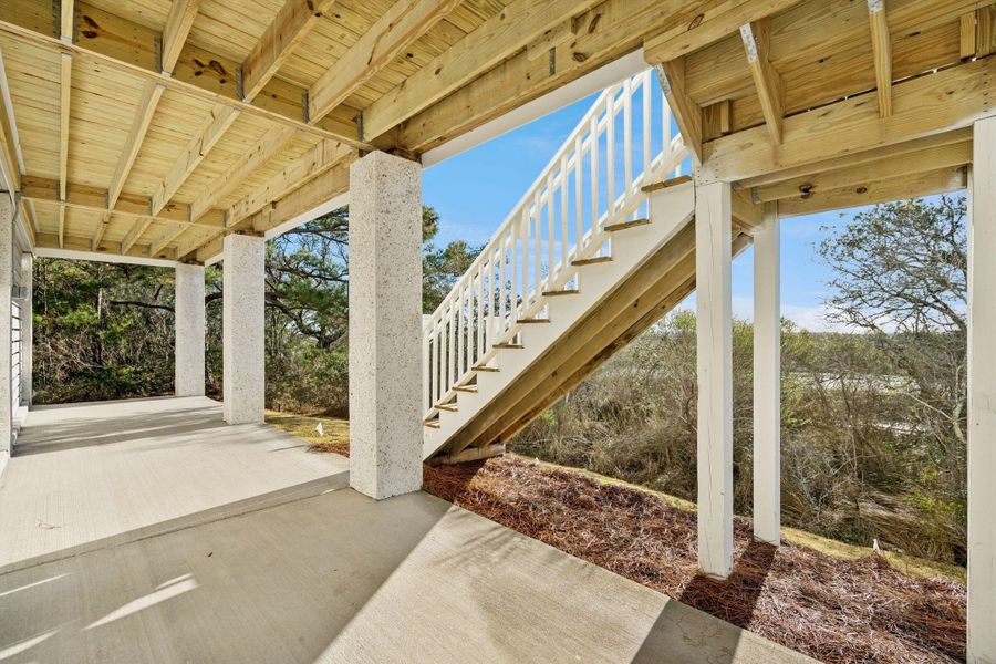 Exterior details and patio area of a home in Overlook at Copahee Sound, Awendaw (Image 34).