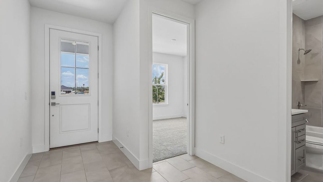 Furnished interior view inside a new home in Ardisia Park, New Smyrna Beach (Image 3).