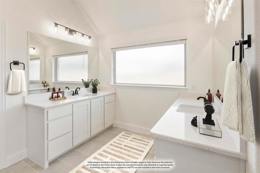 Master bathroom with double vanity, white cabinets, soaking tub, and large mirror with lighted fixtures Master bathroom with double vanity, white cabinets, soaking tub, and large mirror with lighted fixtures