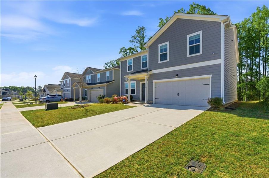 Front exterior of a new home in , Covington, GA, highlighting curb appeal (Image 23). Front exterior of a new home in , Covington, GA, highlighting curb appeal (Image 23).