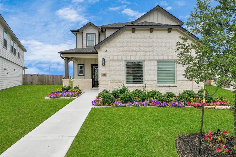 Behold a lush landscape, impeccably maintained yard, and a premium elevation adorned with captivating brick and stone features. Behold a lush landscape, impeccably maintained yard, and a premium elevation adorned with captivating brick and stone features.