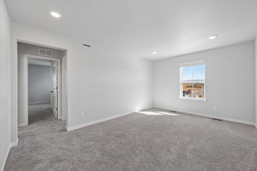 A room with a door and a window.