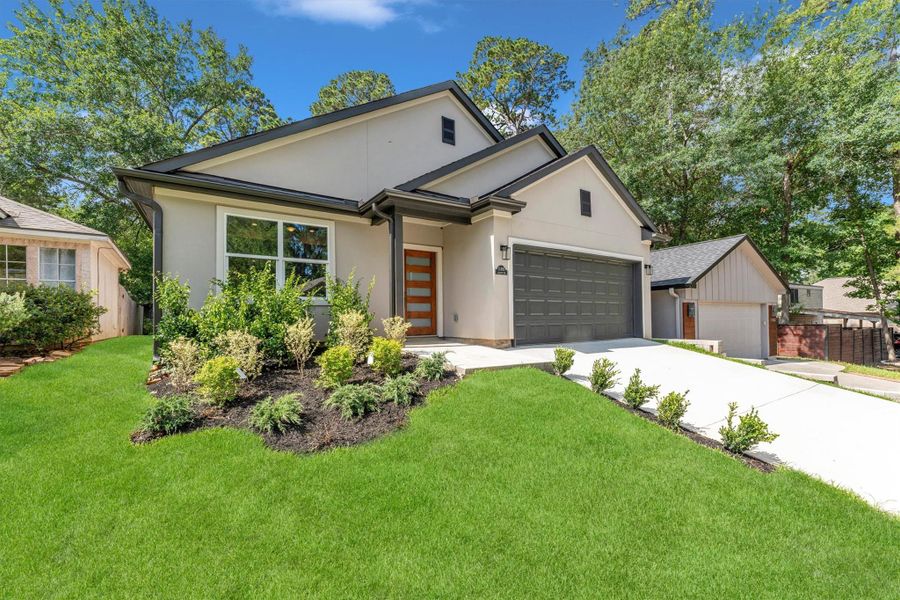 Front exterior of a new home in , Montgomery, TX, highlighting curb appeal (Image 31). Front exterior of a new home in , Montgomery, TX, highlighting curb appeal (Image 31).
