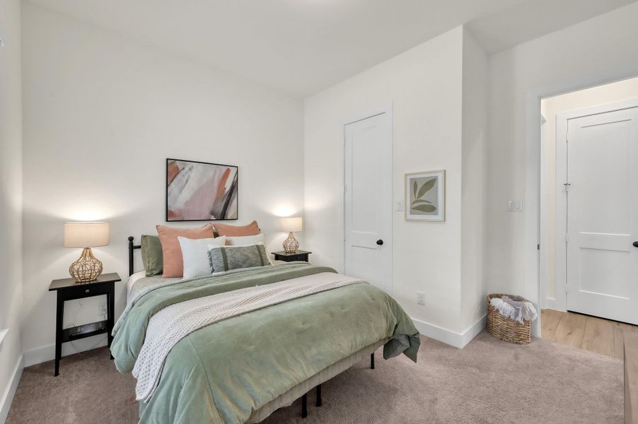 Spacious secondary bedroom perfect for guests, family, or a home office.