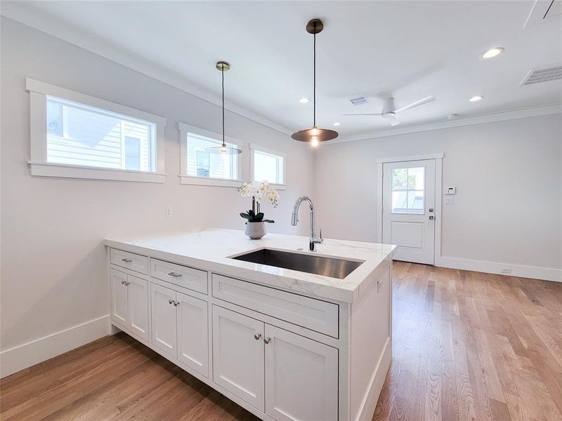 Another view of the Kitchen island and living area