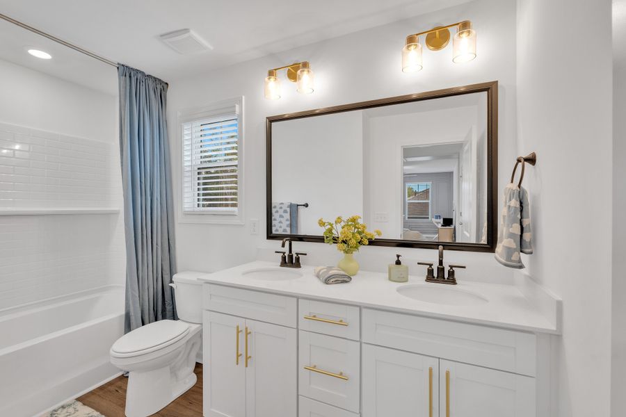Representative furnished interior of a home built from the Benton II by Great Southern Homes in Springwood Grove, Central (Image 9).