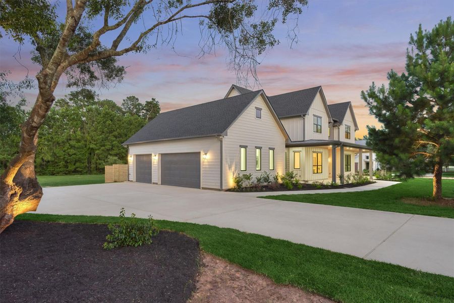 Twilight never looked this good. This modern farmhouse glows from every angle as the sun sets over 1.5 unrestricted acres — mature trees, a flowing front walkway, and warm exterior lighting set the tone before you even walk through the door. Twilight never looked this good. This modern farmhouse glows from every angle as the sun sets over 1.5 unrestricted acres — mature trees, a flowing front walkway, and warm exterior lighting set the tone before you even walk through the door.