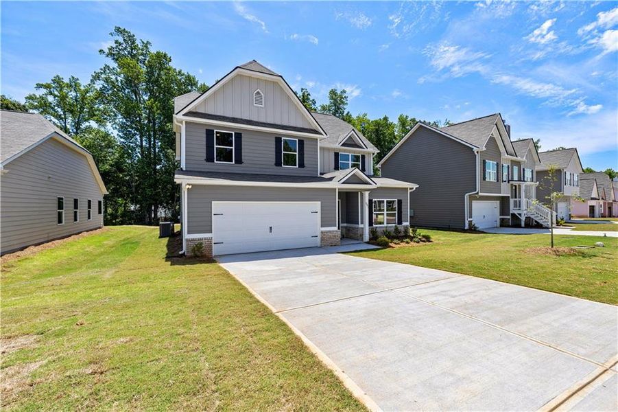 Front exterior of a new home in , Villa Rica, GA, highlighting curb appeal (Image 2).