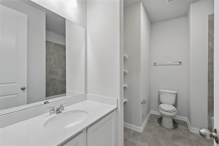 Full bathroom with vanity and light tile patterned floors Full bathroom with vanity and light tile patterned floors