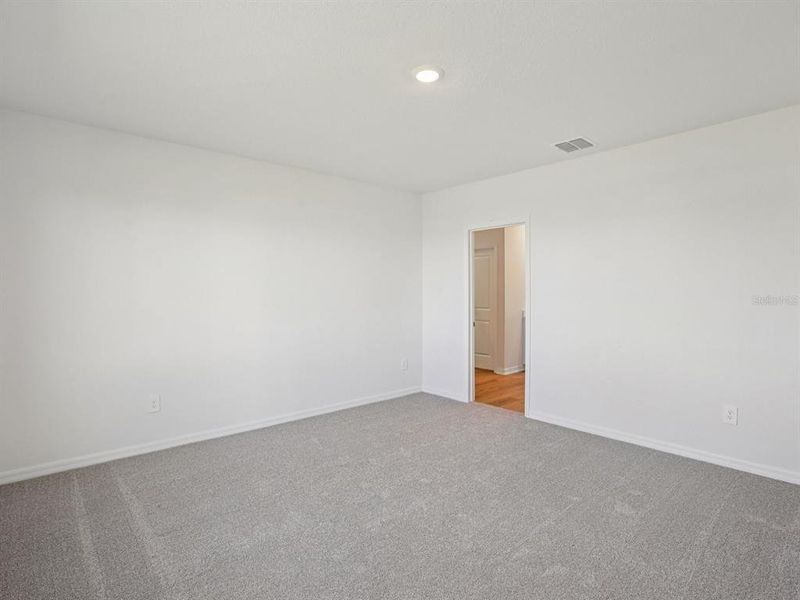 Spacious, unfurnished interior of a new home in The Grove at Stuart Crossing - Classic Series, Bartow (Image 26).