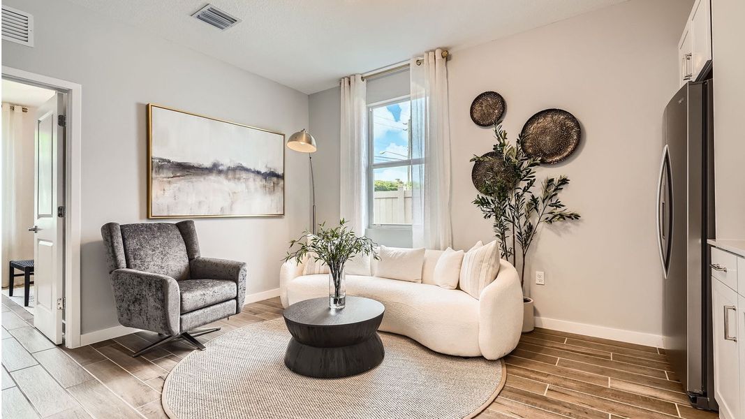 Representative furnished interior of a home built from the Grandcourt by D.R. Horton in Parker Pointe, Homestead (Image 7).