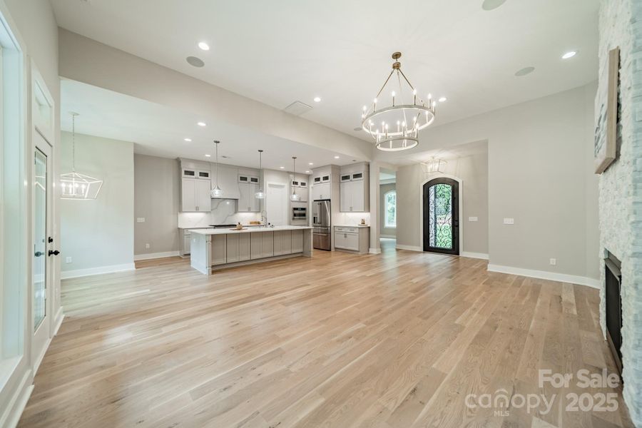 Enjoy stunning Open Concept Living with gorgeous hardwood floors, custom lighting, and luxurious finishes
