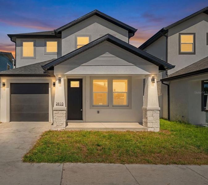 Front exterior of a new home in , Tampa, FL, highlighting curb appeal (Image 2). Front exterior of a new home in , Tampa, FL, highlighting curb appeal (Image 2).