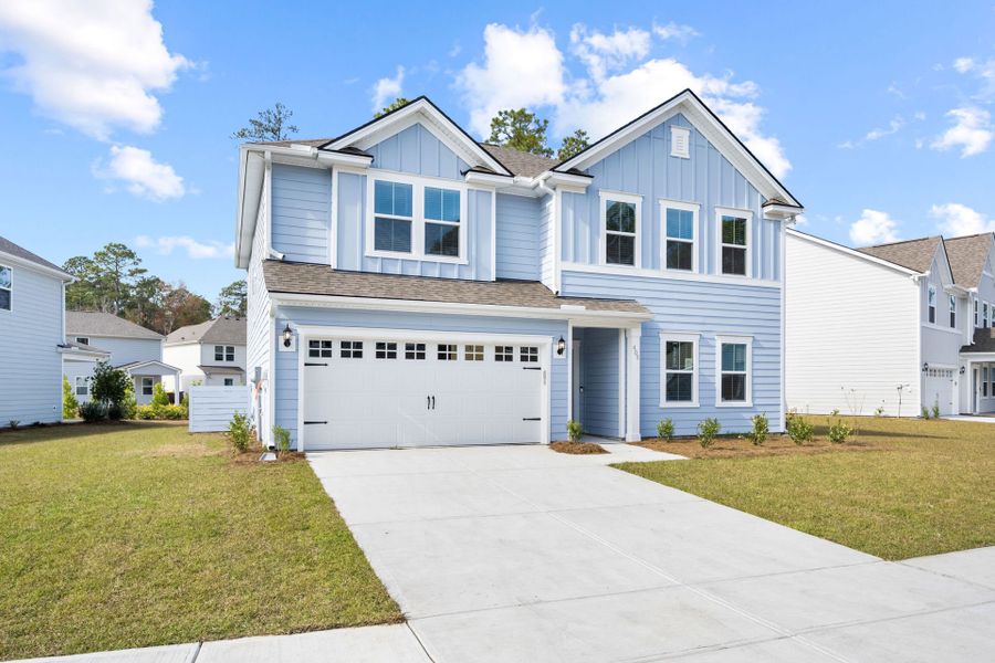 Front exterior of a new home in Waterways, Richmond Hill, GA, highlighting curb appeal (Image 1). Front exterior of a new home in Waterways, Richmond Hill, GA, highlighting curb appeal (Image 1).