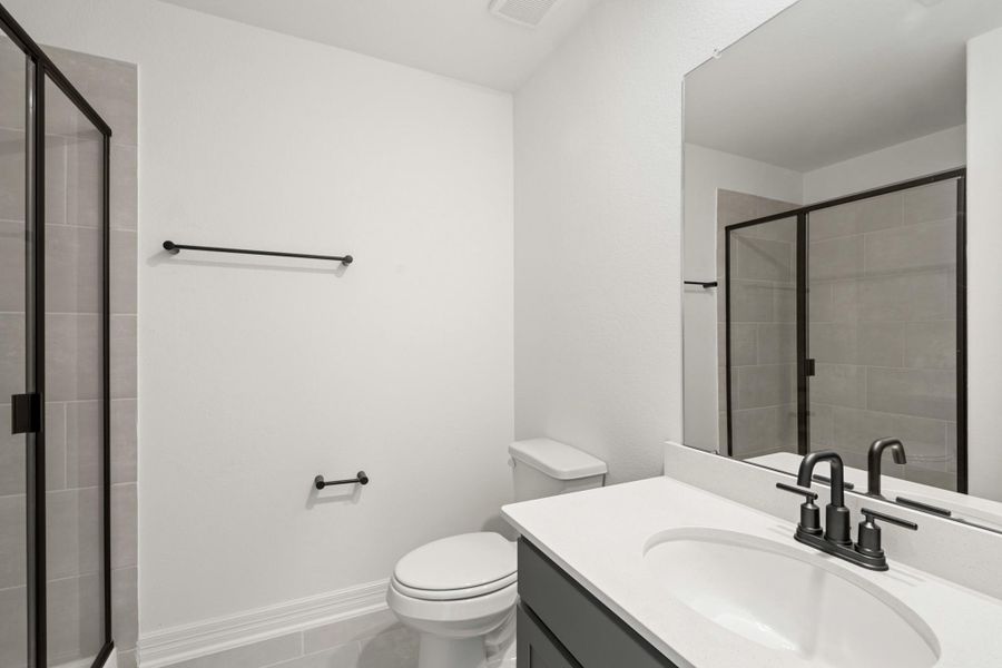 The secondary bath features tile flooring, white cabinetry and light countertops and a shower/tub combo. Perfect for accommodating any visiting family and friends. The secondary bath features tile flooring, white cabinetry and light countertops and a shower/tub combo. Perfect for accommodating any visiting family and friends.