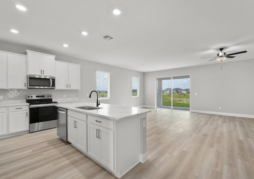The kitchen overlooks the spacious living area.