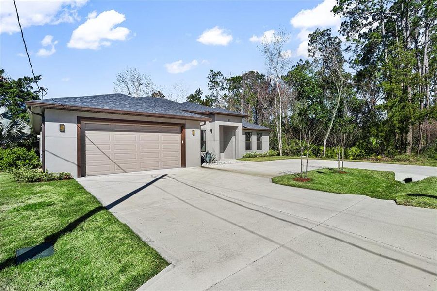 Front exterior of a new home in , Palm Coast, FL, highlighting curb appeal (Image 31).