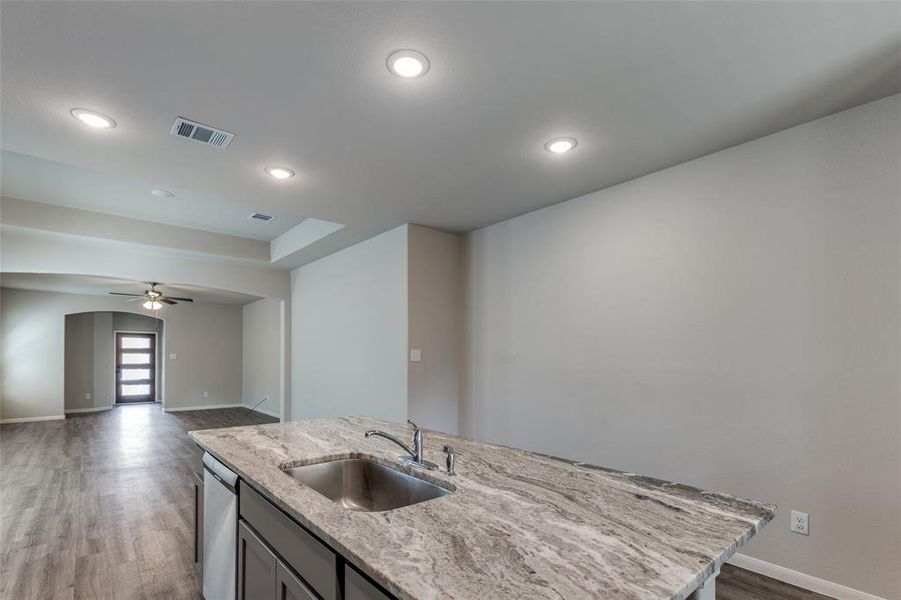 A TV on the wall would be ideal while washing dishes. A small desk below the TV could serve as a convenient temporary workstation while cooking or baking. A TV on the wall would be ideal while washing dishes. A small desk below the TV could serve as a convenient temporary workstation while cooking or baking.