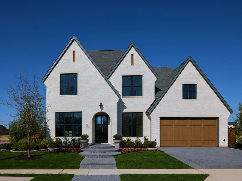 Front exterior of a new home in Custer Ridge Estates, Allen, TX, highlighting curb appeal (Image 4). Front exterior of a new home in Custer Ridge Estates, Allen, TX, highlighting curb appeal (Image 4).