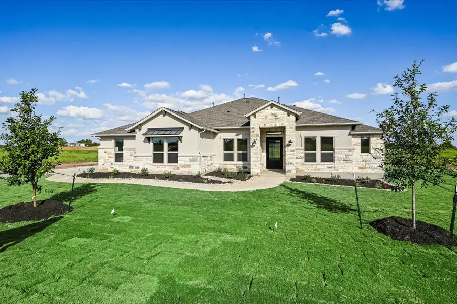 Representative exterior photo of a completed home built from the Llano II by Giddens Homes in Whispering Wind, Bertram, TX (Image 32). Representative exterior photo of a completed home built from the Llano II by Giddens Homes in Whispering Wind, Bertram, TX (Image 32).