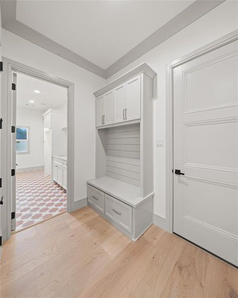 Mudroom with light wood finished floors and baseboards Mudroom with light wood finished floors and baseboards