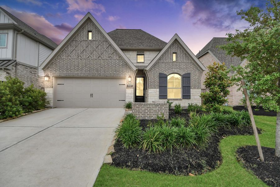 Front exterior of a new home in Bridgeland, Cypress, TX, highlighting curb appeal (Image 1). Front exterior of a new home in Bridgeland, Cypress, TX, highlighting curb appeal (Image 1).