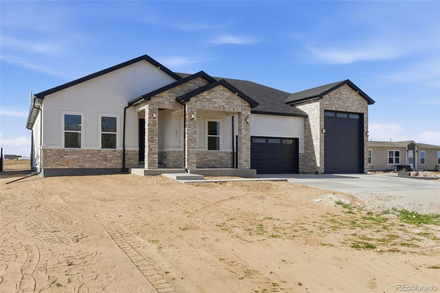 Front exterior of a new home in , Keenesburg, CO, highlighting curb appeal (Image 27).