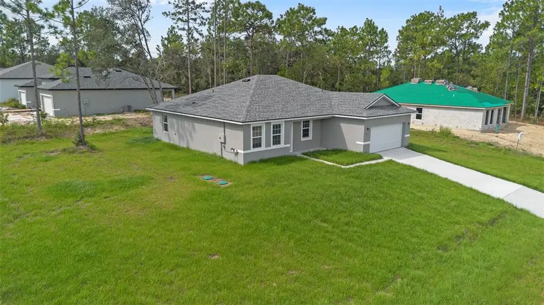 Front exterior of a new home in , Citrus Springs, FL, highlighting curb appeal (Image 2).