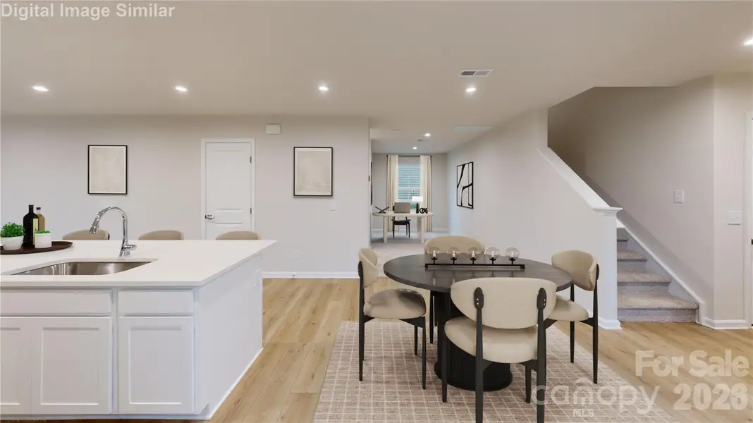 Versatile nook off the dining area - perfectly suited for a cozy reading retreat, a focused homework zone, or  charming space for your furry companion.