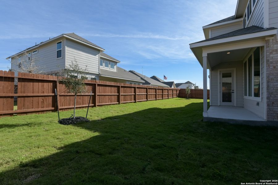 Exterior details and patio area of a home in Megan's Landing 70's, Castroville (Image 3).