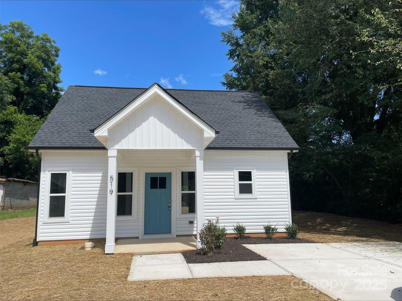 Front exterior of a new home in , Hickory, NC, highlighting curb appeal (Image 1).