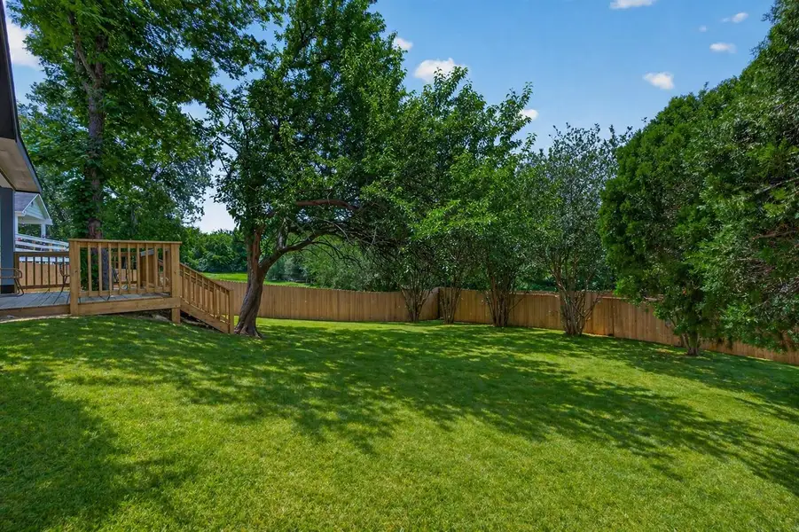 Oversized backyard offering space, privacy, and endless possibilities for outdoor living.