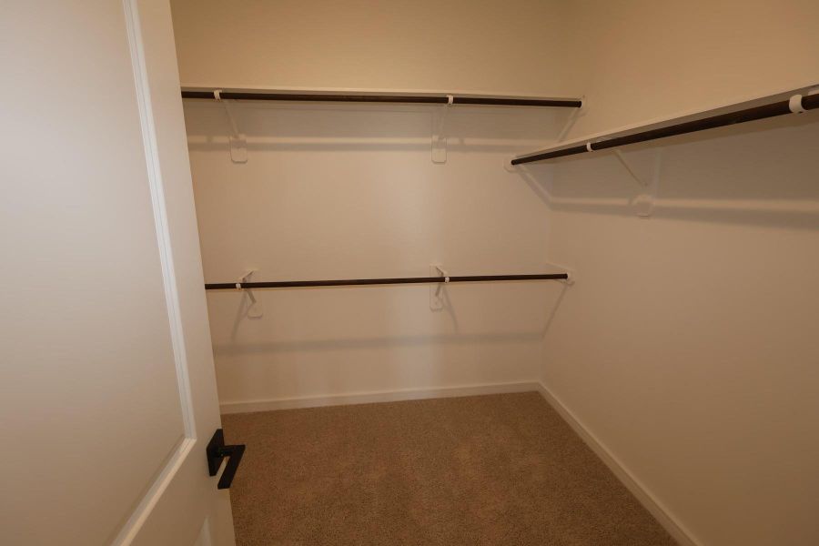 Primary walk-in closet Primary walk-in closet