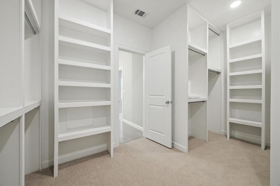 Another view of the generouslysized primary closet.