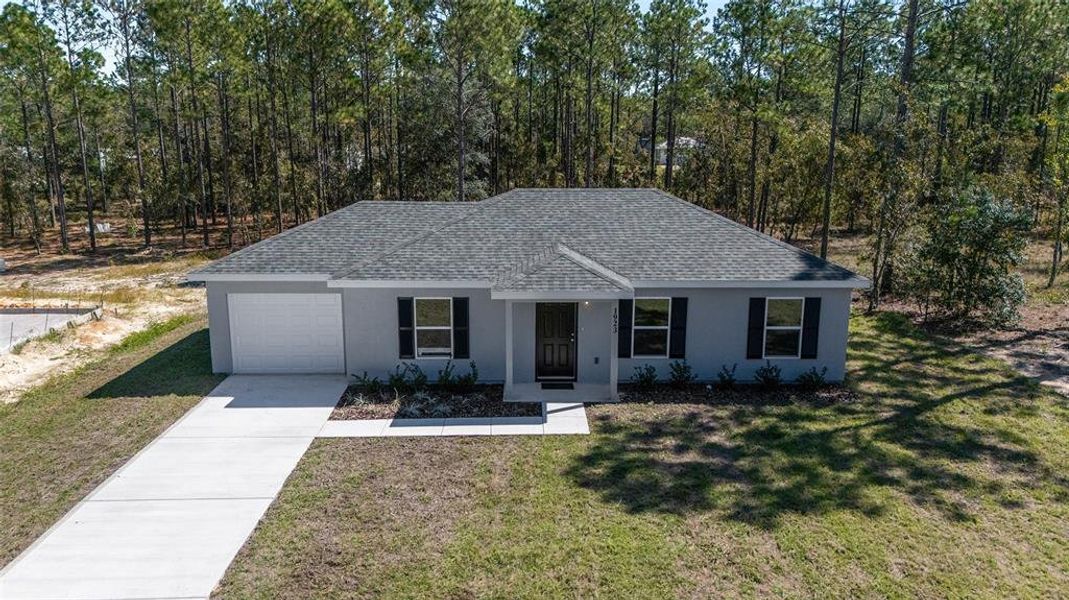 Front exterior of a new home in , Dunnellon, FL, highlighting curb appeal (Image 18). Front exterior of a new home in , Dunnellon, FL, highlighting curb appeal (Image 18).