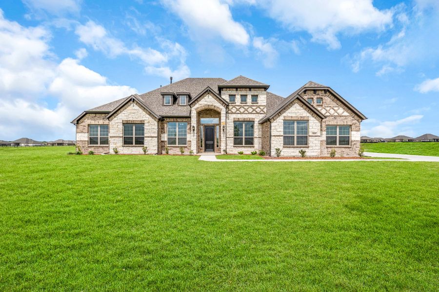 Front exterior of a new home in Creekview Farms, Greenville, TX, highlighting curb appeal (Image 22). Front exterior of a new home in Creekview Farms, Greenville, TX, highlighting curb appeal (Image 22).