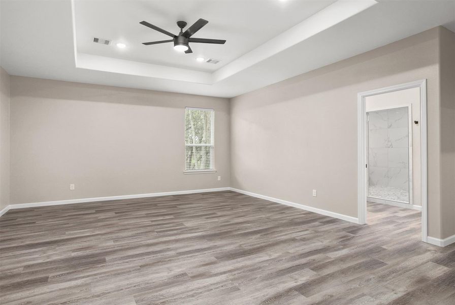 Primary bedroom with en suite bathroom (upstairs)
