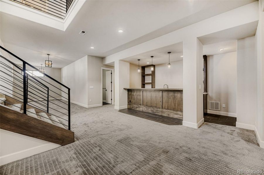 Stairs to finish lower level with custom wet bar
