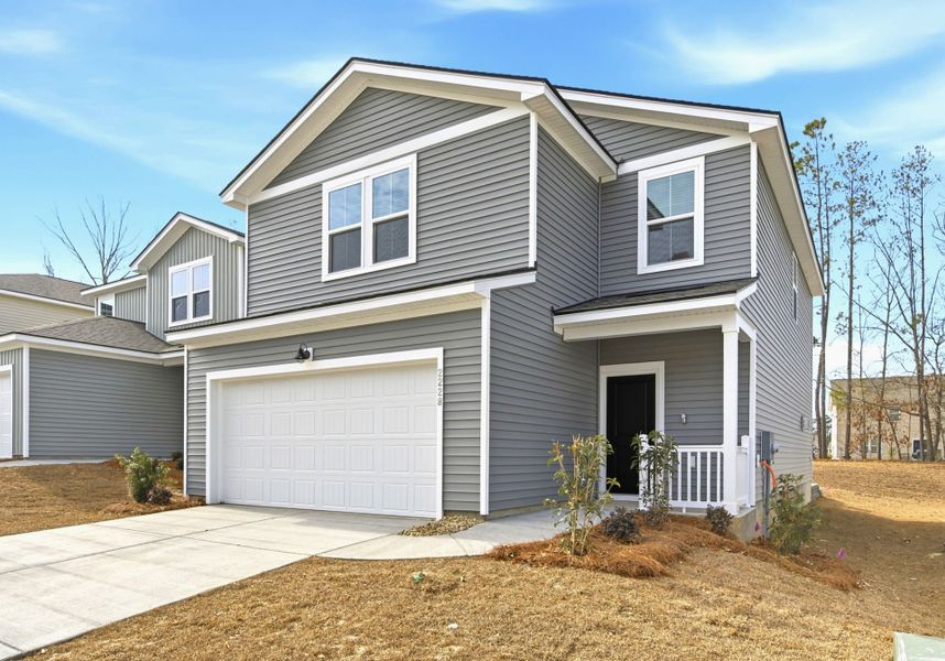 Front exterior of a new home in Grand Arbor, Blythewood, SC, highlighting curb appeal (Image 2). Front exterior of a new home in Grand Arbor, Blythewood, SC, highlighting curb appeal (Image 2).