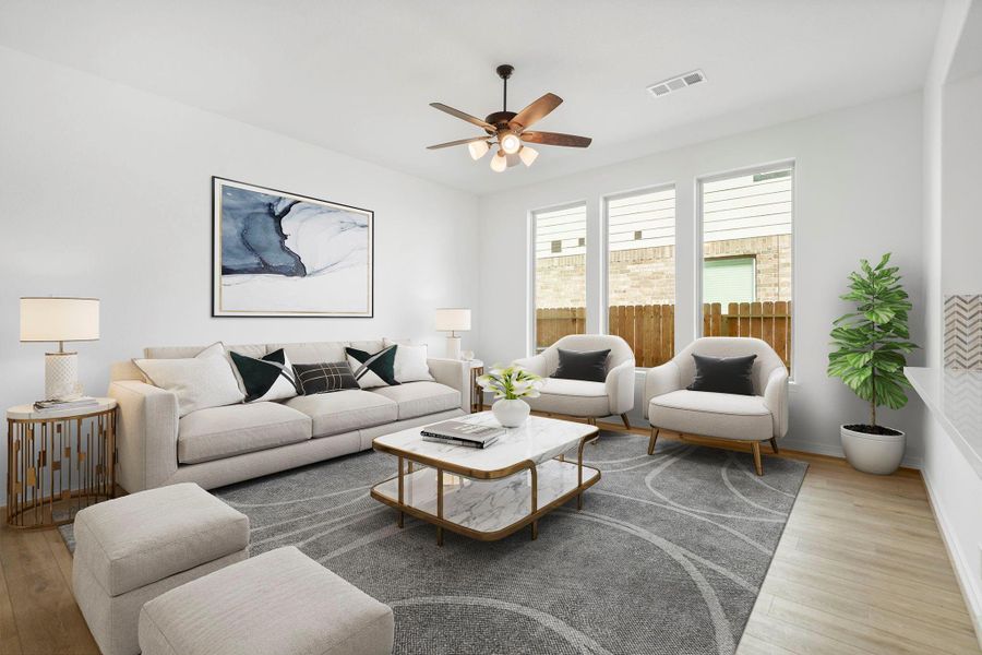 Your family room has ample space to entertain family and friends. This space features beautiful floors, fresh paint, ceiling fan with lighting, and high ceilings.