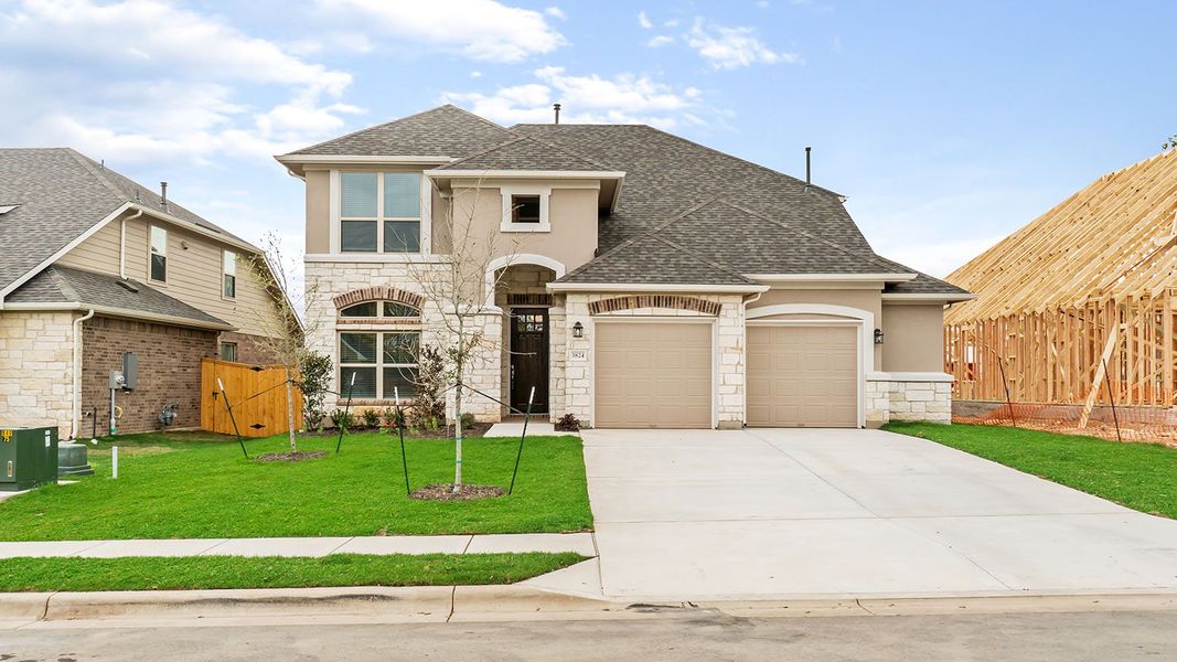 Representative exterior photo of a completed home built from the Thornton by Ashton Woods in Lagos Reserve, Manor, TX (Image 2). Representative exterior photo of a completed home built from the Thornton by Ashton Woods in Lagos Reserve, Manor, TX (Image 2).