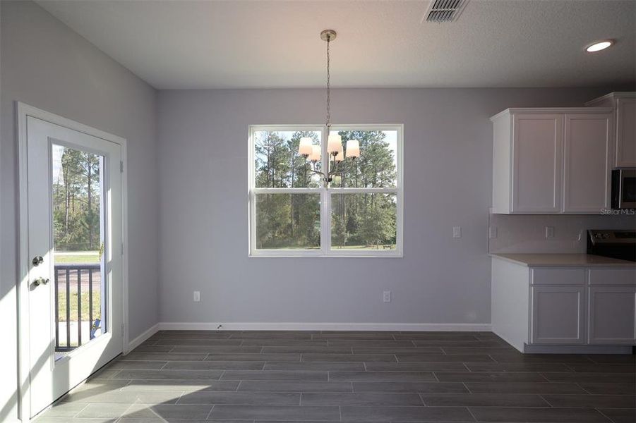 Spacious, unfurnished interior of a new home in Tribute at Ovation, Winter Garden (Image 22).