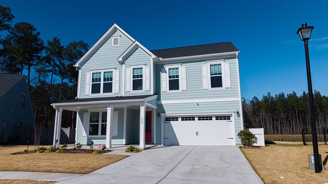 Front exterior of a new home in , Ravenel, SC, highlighting curb appeal (Image 27).