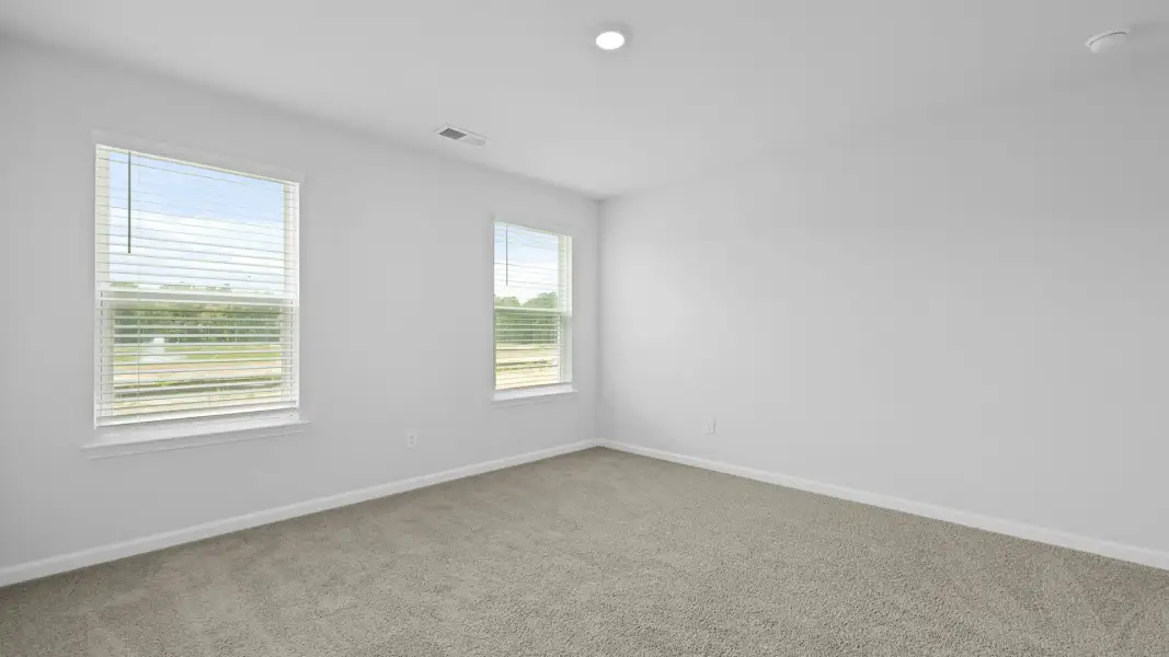 Spacious, unfurnished interior of a new home in Pine Hills Townhomes at Cane Bay, Summerville (Image 31). Spacious, unfurnished interior of a new home in Pine Hills Townhomes at Cane Bay, Summerville (Image 31).