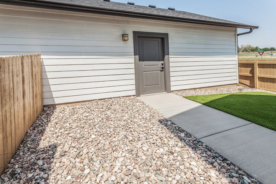 Exterior details and patio area of a home in Prairie Song, Windsor (Image 28). Exterior details and patio area of a home in Prairie Song, Windsor (Image 28).