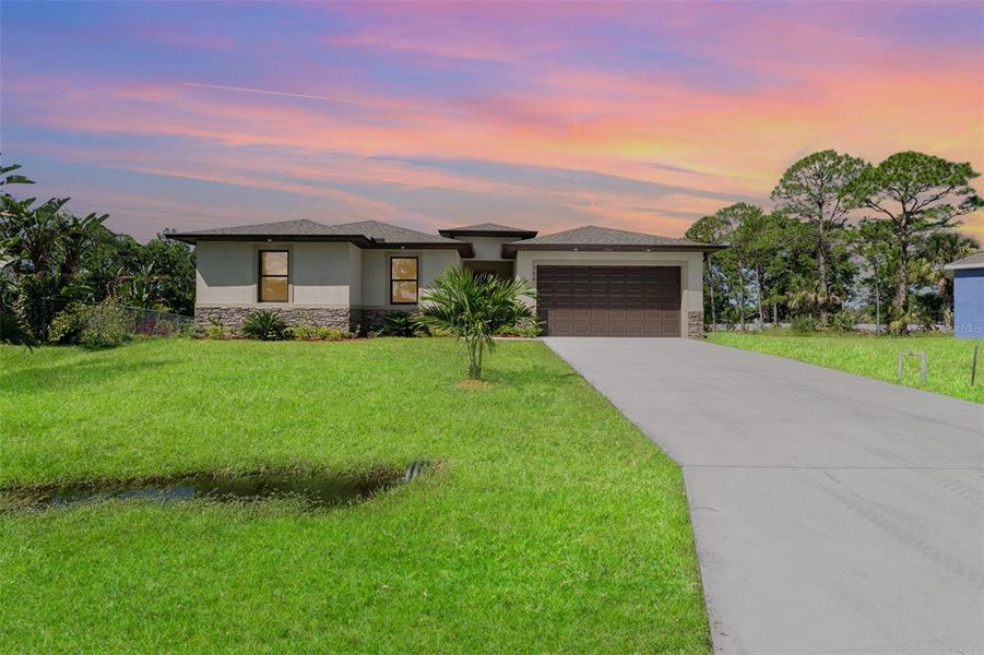 Front exterior of a new home in , Palm Bay, FL, highlighting curb appeal (Image 27). Front exterior of a new home in , Palm Bay, FL, highlighting curb appeal (Image 27).
