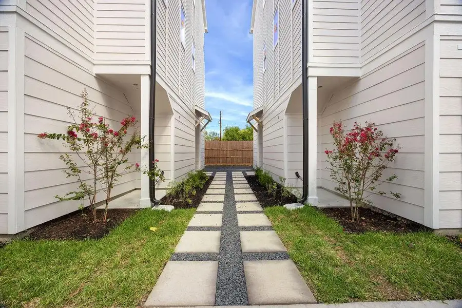 Exterior details and patio area of a home in Villas at Mary, Houston (Image 3).