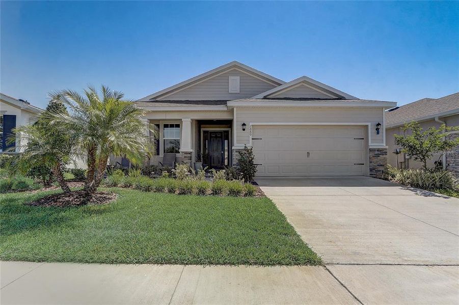 Front exterior of a new home in Beaumont, Wildwood, FL, highlighting curb appeal (Image 1).